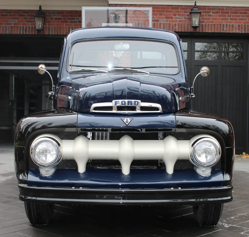 A vintage Ford pickup, detailed and gleaming