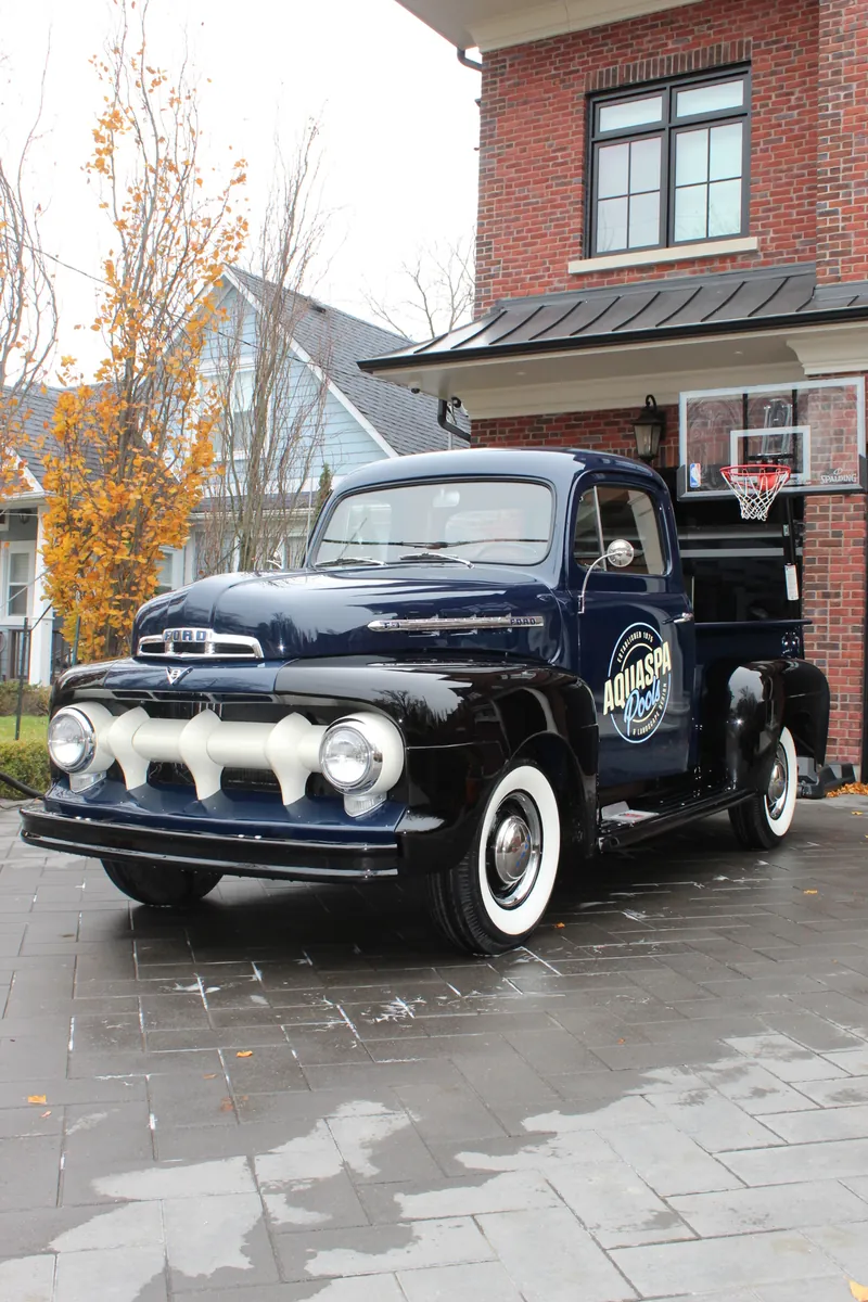 A customer's vintage Ford pickup, freshly detailed in their driveway