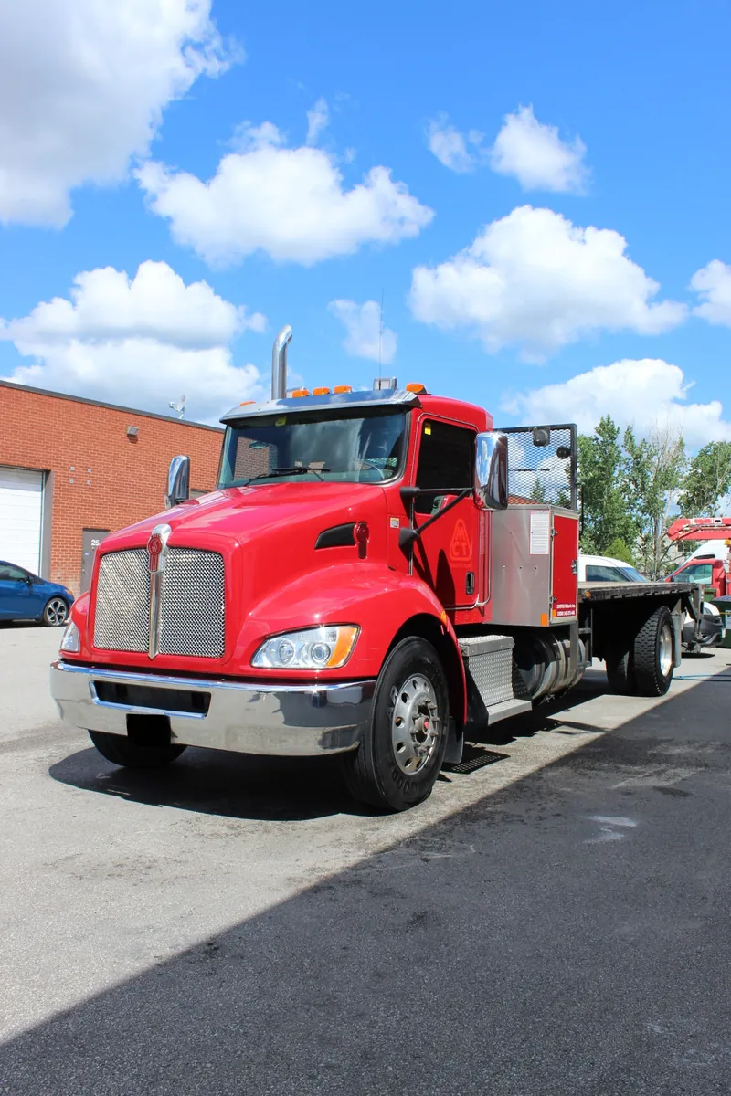 Red tow truck washed and shining